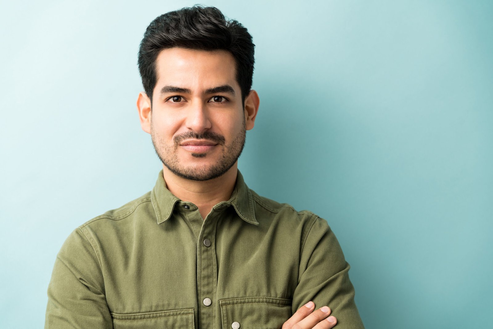 man standing against blue background